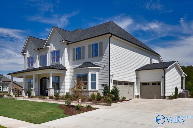 view of front facade featuring a garage, a porch, a front yard, and cooling unit