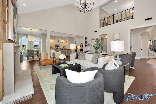 living room featuring dark hardwood / wood-style flooring and an inviting chandelier