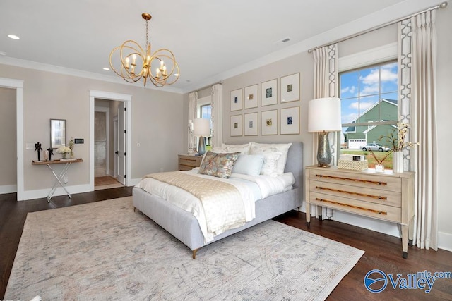 2106 Forest Gate SW, Huntsville, AL 35802 - bedroom with wood finished floors, a chandelier, and multiple windows