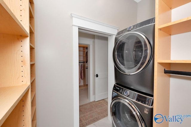 2106 Forest Gate SW, Huntsville, AL 35802 - clothes washing area featuring stacked washer / dryer and laundry area