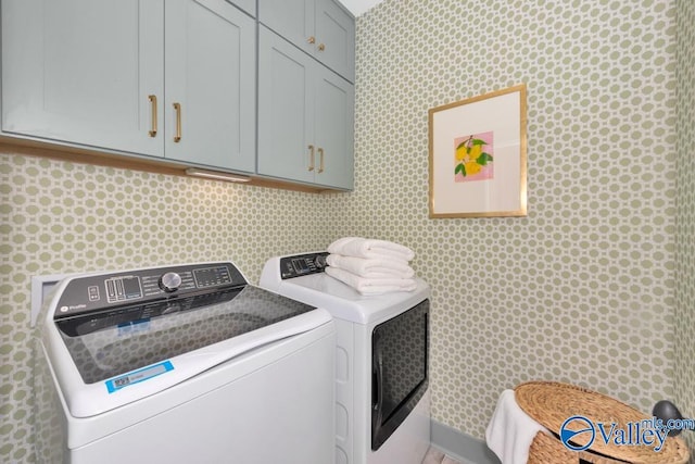 2106 Forest Gate SW, Huntsville, AL 35802 - laundry area featuring cabinet space, washer and clothes dryer, and wallpapered walls