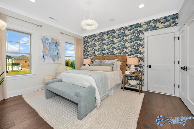 2106 Forest Gate SW, Huntsville, AL 35802 - bedroom with dark wood-style floors, baseboards, wallpapered walls, and visible vents