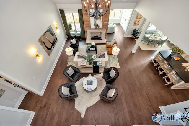 living room featuring dark hardwood / wood-style floors and a chandelier