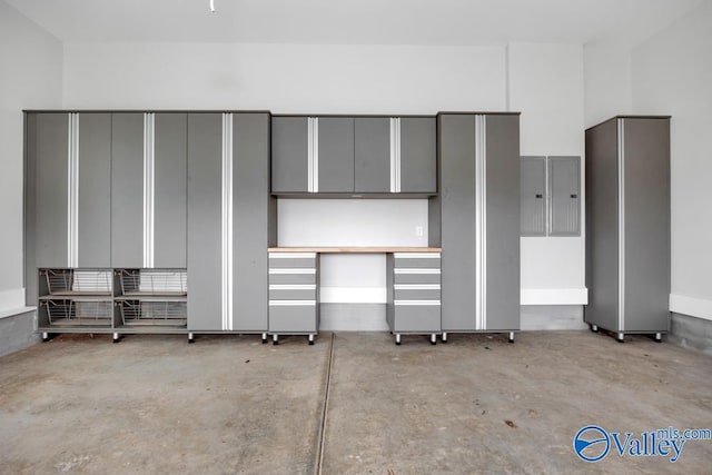 2106 Forest Gate SW, Huntsville, AL 35802 - unfurnished bedroom featuring electric panel and concrete floors