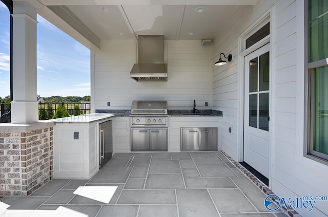 view of patio featuring sink, grilling area, and exterior kitchen