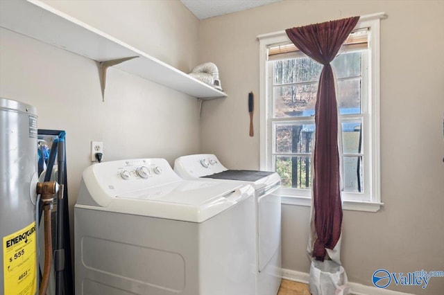 washroom with separate washer and dryer and a wealth of natural light