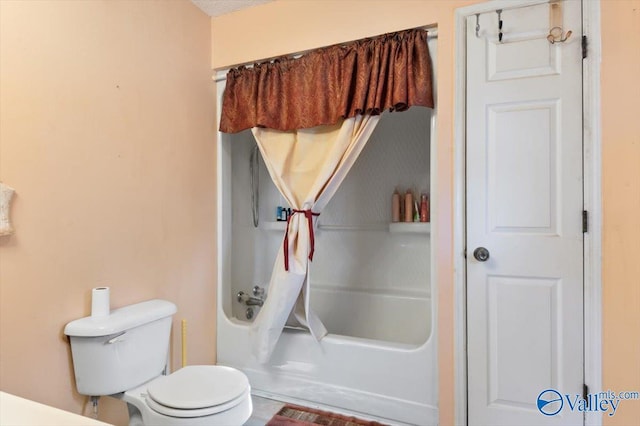 bathroom with toilet, a textured ceiling, and shower / tub combination