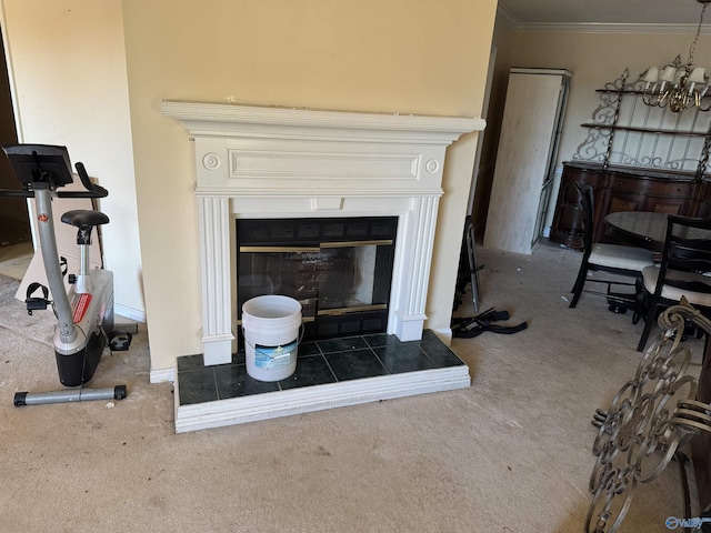 interior details featuring crown molding, carpet floors, and a fireplace