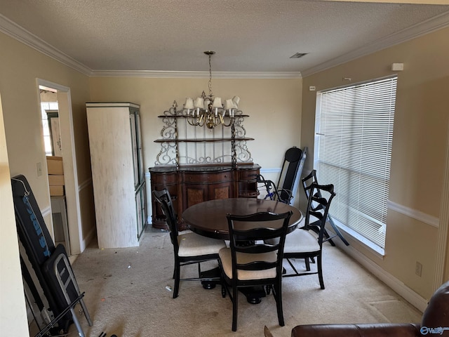 dining space featuring crown molding, light carpet, a textured ceiling, and an inviting chandelier