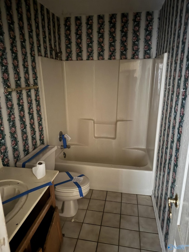 full bathroom with tile patterned flooring, vanity, bathtub / shower combination, and toilet