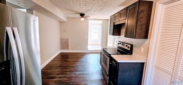 kitchen with visible vents, ceiling fan, stainless steel appliances, a textured ceiling, and light countertops