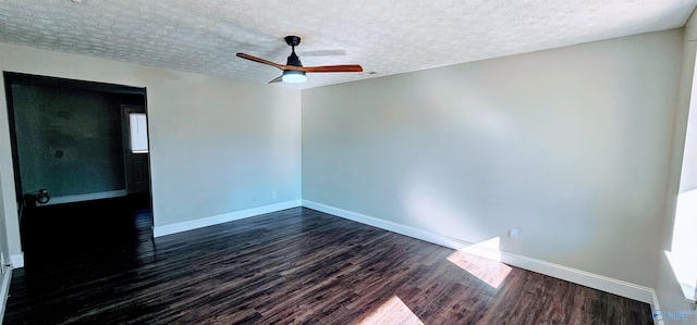 unfurnished room featuring dark wood-style floors, a textured ceiling, a ceiling fan, and baseboards