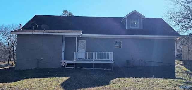 back of house featuring stucco siding