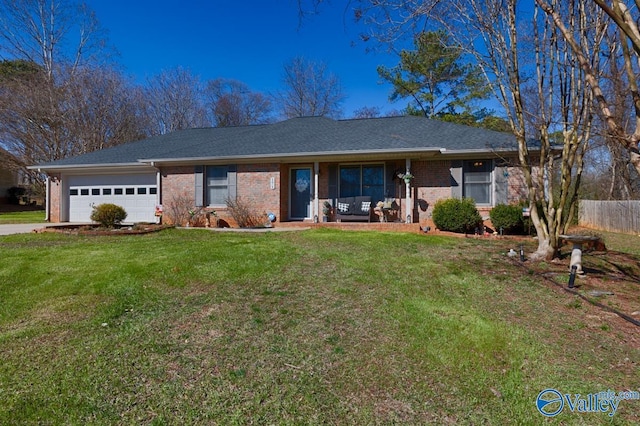 ranch-style house featuring a garage, a front yard, brick siding, and a porch