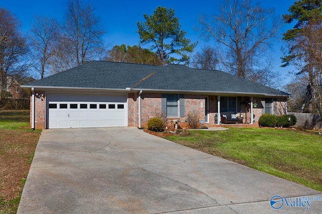 single story home with driveway, a shingled roof, a front lawn, and brick siding