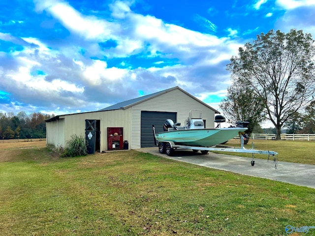 view of outdoor structure featuring a lawn and a garage