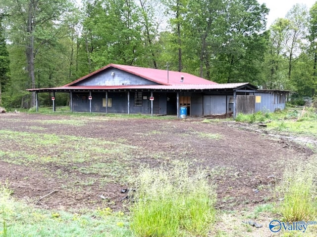 view of front of house featuring metal roof