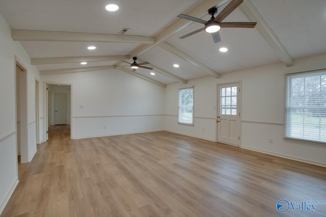 unfurnished room with light wood-type flooring, visible vents, baseboards, ceiling fan, and vaulted ceiling with beams