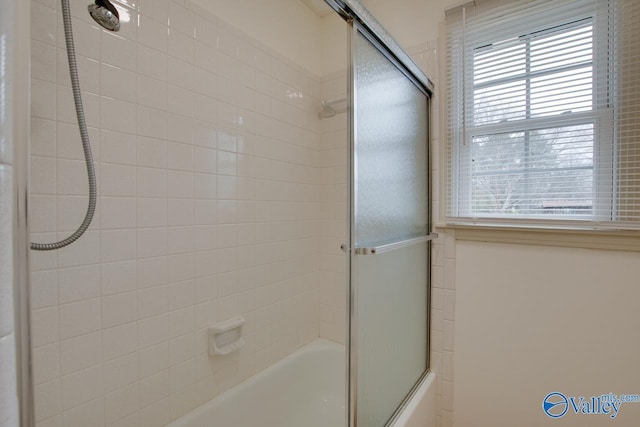 full bath with shower / bath combination with glass door