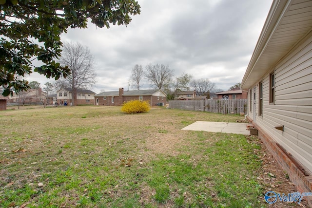 view of yard featuring fence and a patio area