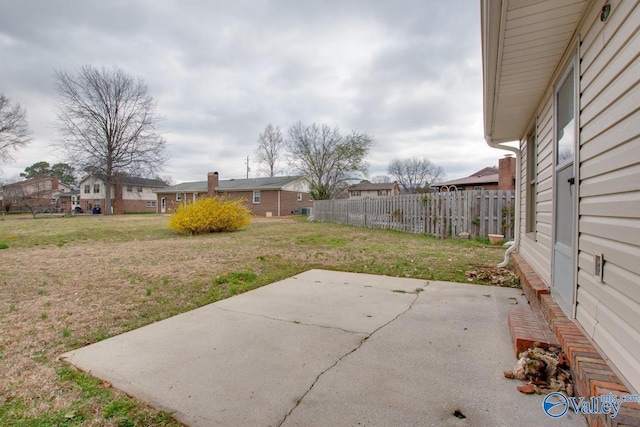 view of yard featuring a patio and fence