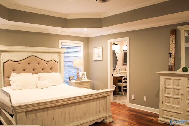 bedroom with ornamental molding, ensuite bath, and dark hardwood / wood-style floors