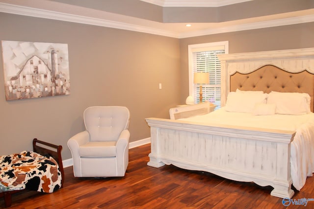 bedroom featuring dark hardwood / wood-style floors and ornamental molding