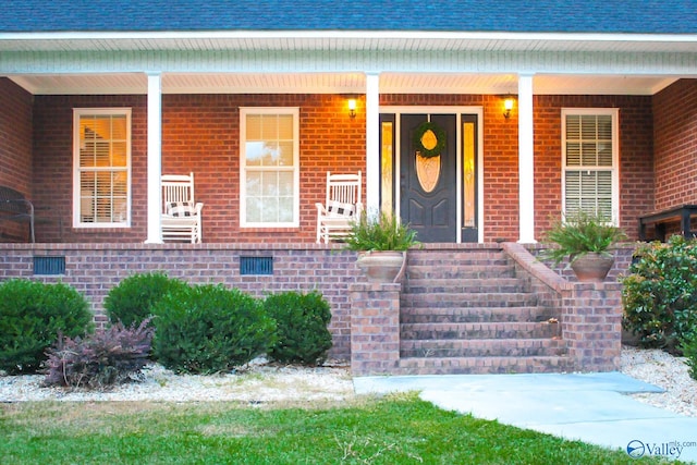 property entrance with covered porch