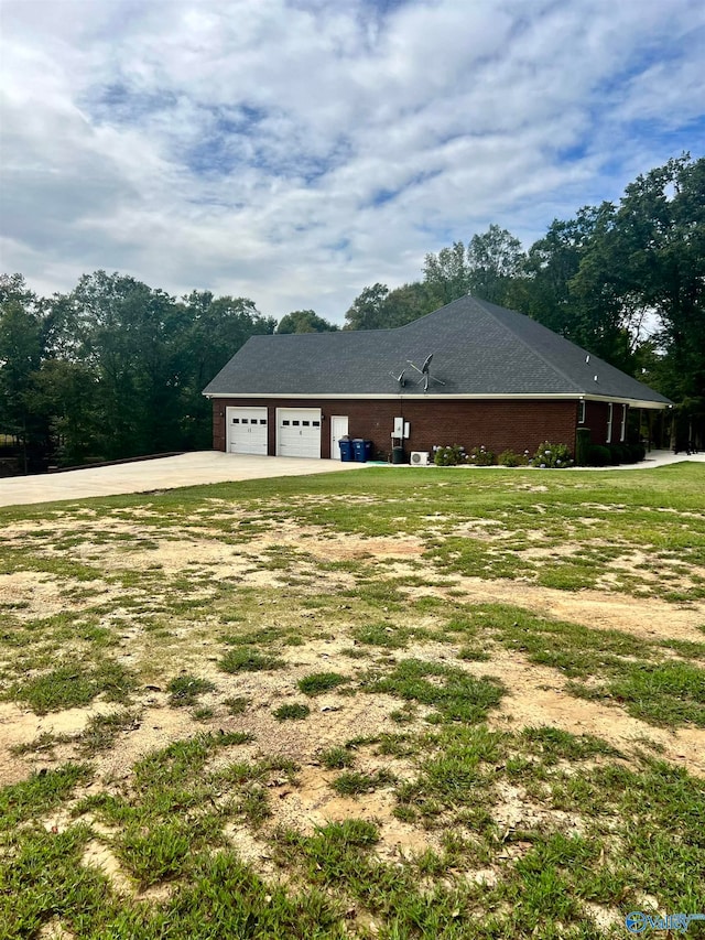 exterior space featuring a yard and a garage