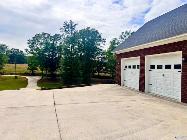 garage with a lawn