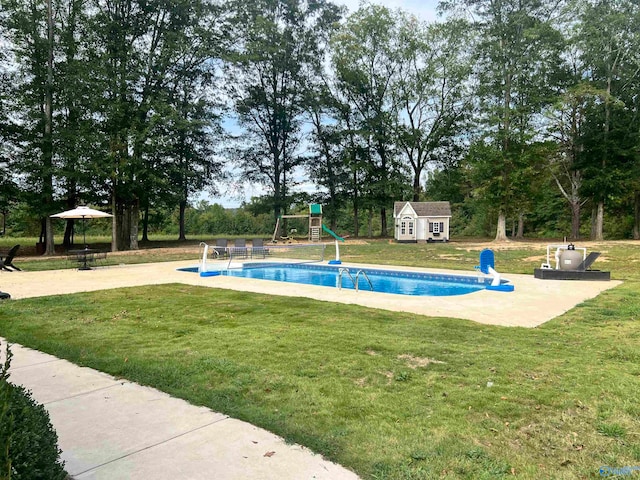 view of pool with a playground, a patio, a storage unit, a gazebo, and a lawn