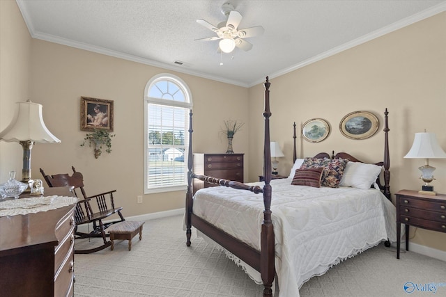 carpeted bedroom with a textured ceiling, ornamental molding, and ceiling fan