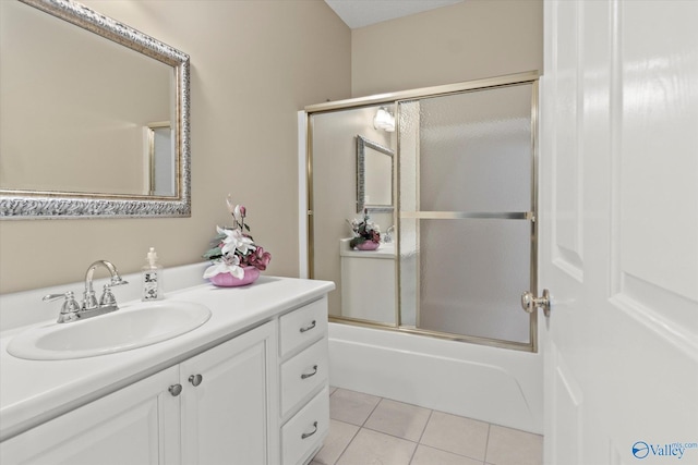 bathroom featuring vanity, tile patterned floors, and shower / bath combination with glass door