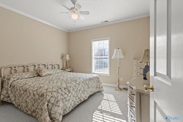 bedroom with ornamental molding, light carpet, a textured ceiling, and ceiling fan