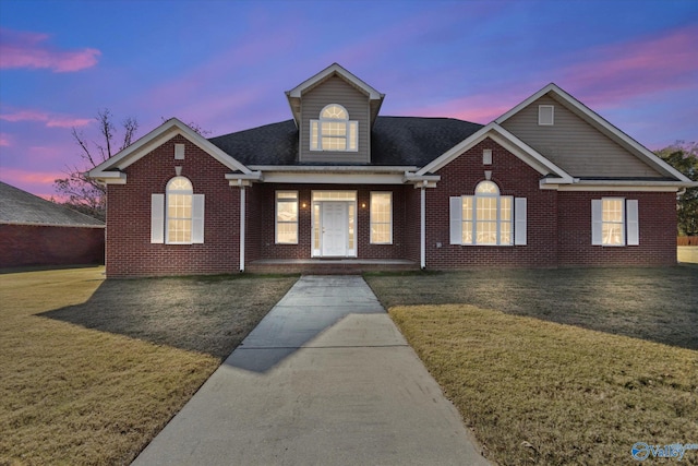 view of front of home with a lawn