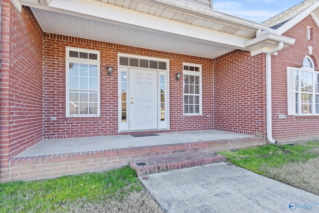 entrance to property featuring a porch