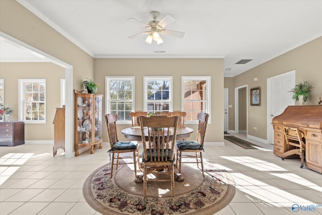 dining room with light tile patterned flooring, ceiling fan, and ornamental molding