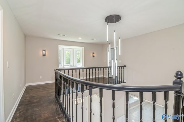 hallway with dark hardwood / wood-style floors