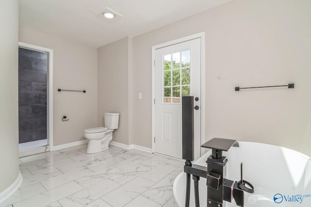 bathroom with a shower and toilet