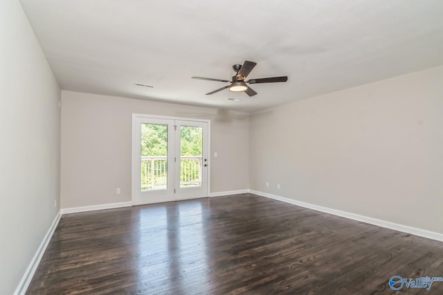 spare room featuring ceiling fan and dark hardwood / wood-style flooring