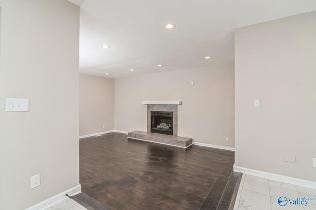 unfurnished living room with a tile fireplace