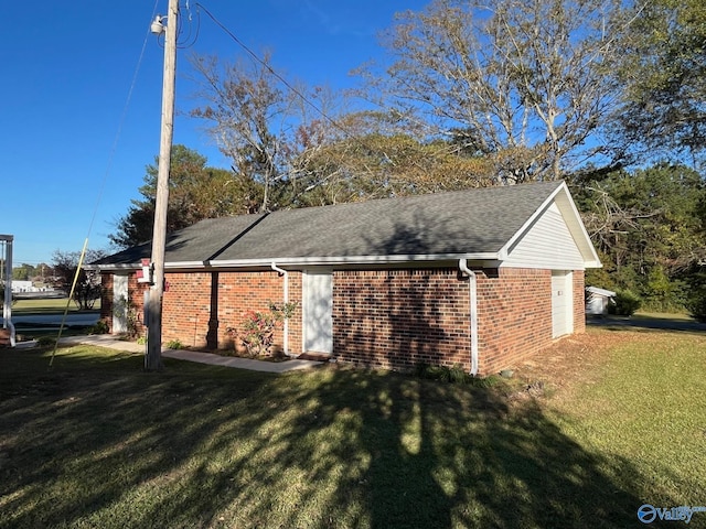 view of side of home featuring a yard