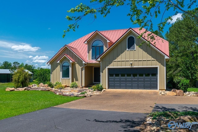 3623 Barkley Bridge Rd, Hartselle, AL 35640 - view of front facade with driveway, board and batten siding, a garage, metal roof, and a front lawn