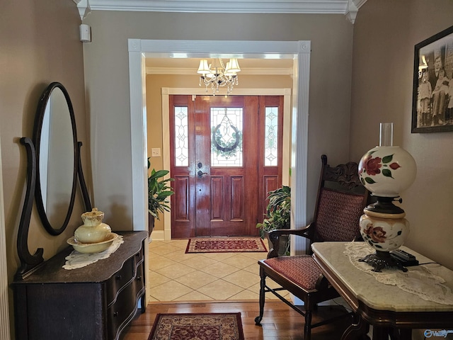 809 Kyle Rd NE, Hartselle, AL 35640 - entrance foyer with light wood-style floors, a chandelier, and ornamental molding