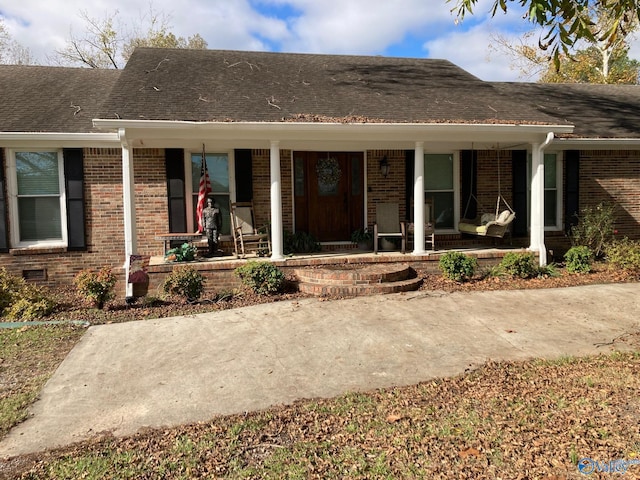 view of front of home featuring covered porch