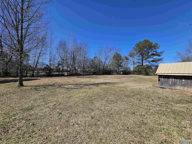 809 Kyle Rd NE, Hartselle, AL 35640 - view of green lawn featuring an outbuilding