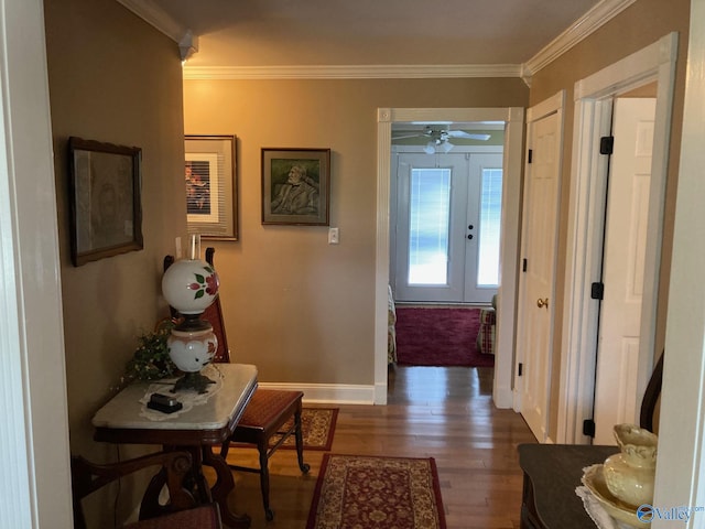 hallway with crown molding, french doors, and dark hardwood / wood-style floors