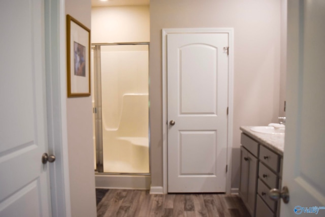 117 Edensmith Dr, New Market, AL 35761 - full bath featuring a shower stall, wood finished floors, and vanity