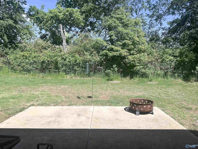 117 Edensmith Dr, New Market, AL 35761 - view of green lawn featuring a fire pit and a patio area
