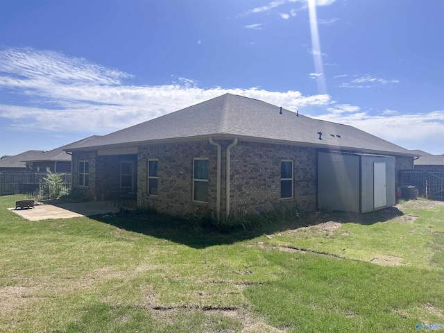 117 Edensmith Dr, New Market, AL 35761 - back of property with a patio area, central AC unit, and brick siding